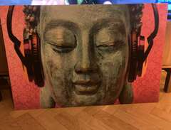 Tavla Buddha med hörlurar