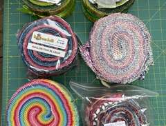 Jelly Roll fabric strip packs.