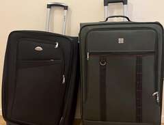 23 kg svart resväska och 32...