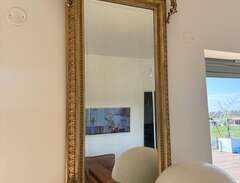 Stor antik spegel