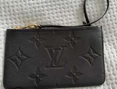Louis Vuitton leather clutc...