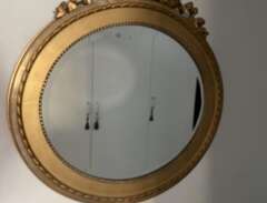 Antik dekorativ guldspegel