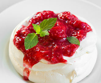 Individual Pavlovas with Cream Cheese Whipped Cream and Raspberry Sauce