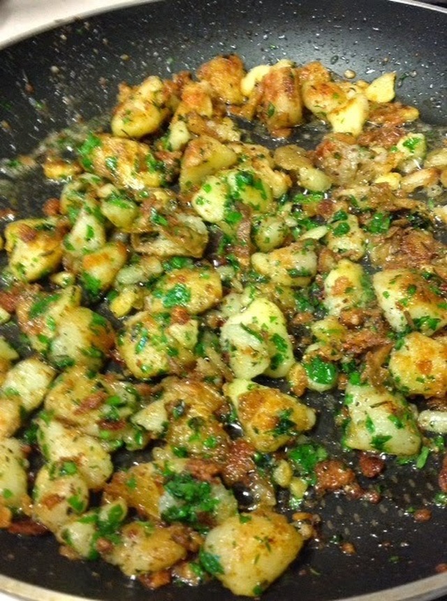 New potatoes with garlic and rosemary by Maria Kuehn