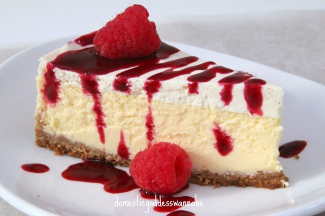 perfect lemon cheesecake with vanilla bean sour cream and raspberry coulis