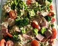 Healthy lukewarm green Greek pasta salad