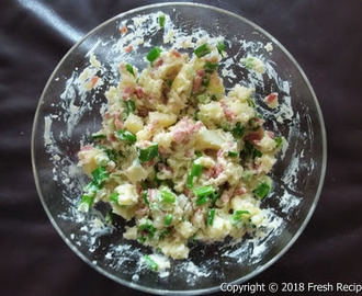 Potato salad with bacon and spring onions