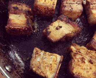 Pork belly braised in beer, with Cajun spices