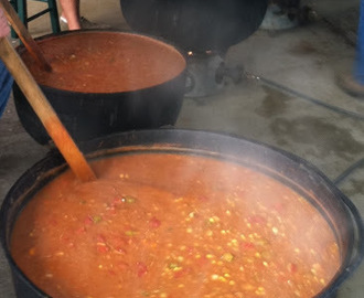 Stirring the Pot – Stew Masters blend the ingredients in seasoned black kettles until the Brunswick Stew is just right!