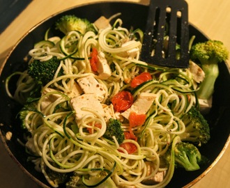Lightly cooked zucchini noodles with a tomato basil sauce
