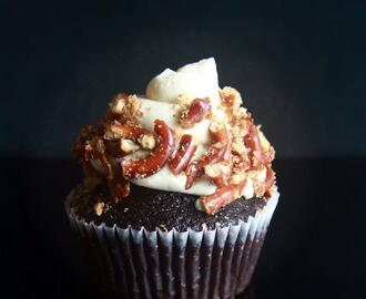 salted caramel filled chocolate cupcakes with vanilla cream cheese buttercream and pretzels.