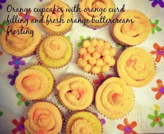 Orange cupcakes with orange curd filling and fresh orange buttercream frosting