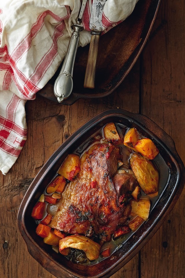Slowly baked lamb with carrots, potatoes and artichokes in red wine sauce