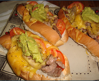 Cheese steak sandwich with tomato and guacamole