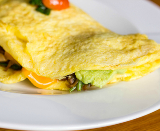 How to make the Perfect Omelette Stuffed with Caramelized Onions, Cherry Tomatoes, and Spinach