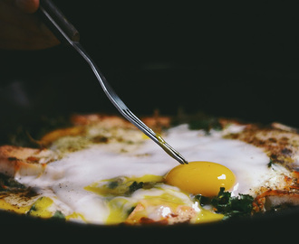 breakfast naan skillet pizza with mustard greens and paneer