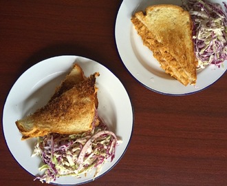 bbq pulled chicken and cabbage slaw sandwich
