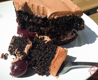 chocolate cake with cherry filling and chocolate butter cream frosting