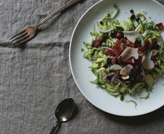 Shaved brussels sprout salad with currants and bacon vinaigrette
