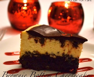 Brownie Bottom Cheesecake with Chocolate Ganache and Raspberry Sauce