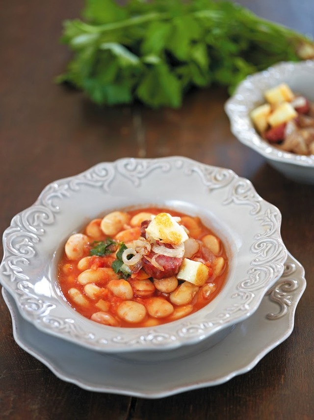 Spicy giant beans soup served with country-style sausages