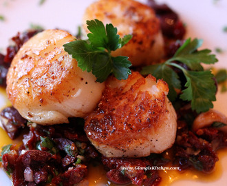 Seared sea scallops with garlic, sun dried tomatoes and olive compote.