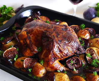 Roast thyme, parsley & onion stuffed chicken in a red wine & balsamic sauce with baby potatoes and figs