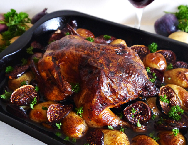 Roast thyme, parsley & onion stuffed chicken in a red wine & balsamic sauce with baby potatoes and figs