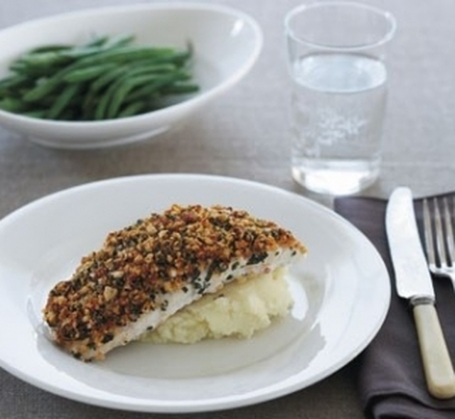 Fish with cashew and basil topping