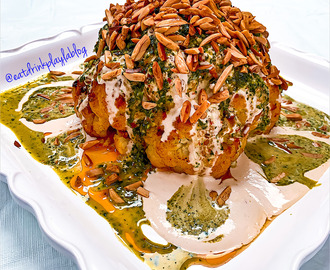 SPICY ROASTED WHOLE CAULIFLOWER WITH CILANTRO SAUCE, TAHINI SAUCE & CRUNCHY ALMONDS