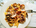 TROFIE PASTA IN CLAMS AND BACON SAUCE