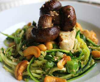 Sesame sprinkled courgetti with Irish parsley & butter roasted chestnut mushrooms, chicken, spring onion and cashew nuts