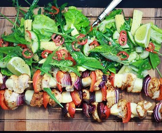 Chicken skewers with a fiery rocket, lime and baby corn salad