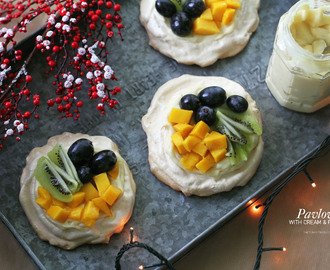 Pavlova topped with cream and fruits make for a beautiful Christmas dessert
