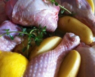 Chicken legs roast with lemon, garlic and Charlotte potatoes