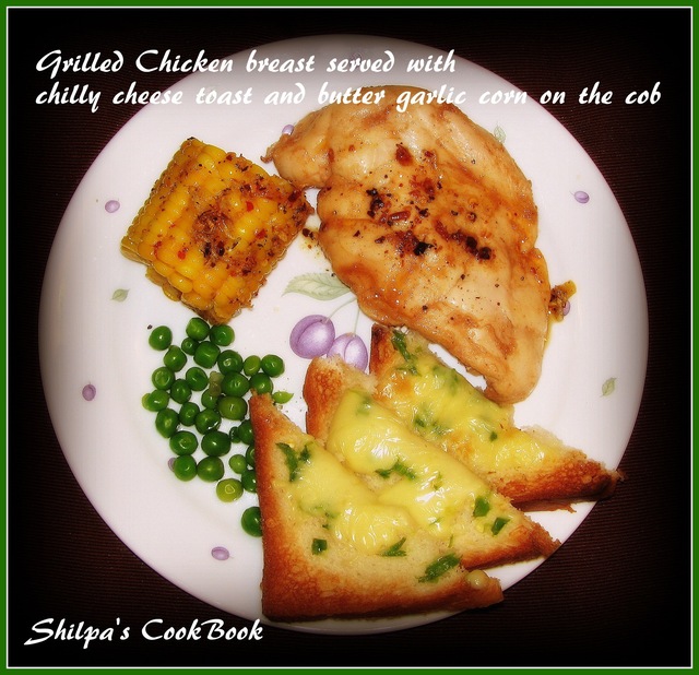 Grilled Chicken breast with Chilly Cheese Toast and Butter Garlic Corn on the Cob