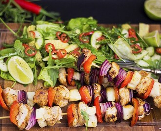 Chicken skewers with a fiery rocket, lime and baby corn salad