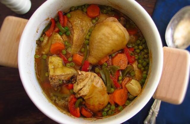 Stewed chicken with peas, carrot and peppers