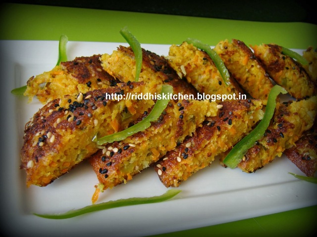 Oats Handvo ( Famous Gujrati snack( with some twist) cooked with oats , sooji and vegetables )