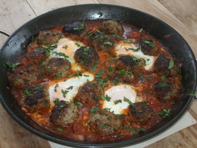 Kefta Mkaouara, or a simple, tasty Moroccan dish of lamb meatballs and egg in a tomato and cumin sauce.