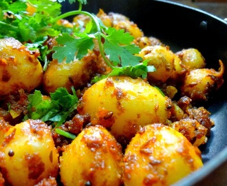 Spicy Jeera Aaloo   ( Baby potatoes tossed in  crushed cumin seeds and aromatic Indian spices )