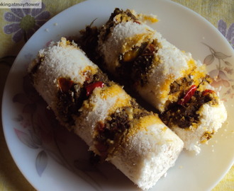 Erachi puttu / Steamed rice flour cake layered with spicy meat mixture.