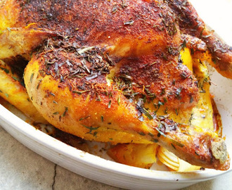 Kurczak pieczony w maśle, tymianku i estragonie, nadziewany cytryną, cebulą i czosnkiem