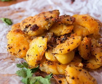 Smashed potatoes with chilli flakes and herbs