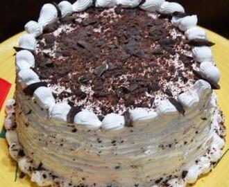 Dark chocolate cake with whipped cream