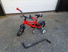 barncykel med stödhjul och...