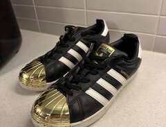 Adidas Superstar with gold...