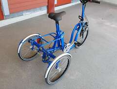 Trehjulig hopfällbar cykel.