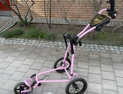 Trehjulig rosa golfvagn