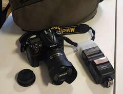 Nikon D7000 + objektiv & ti...